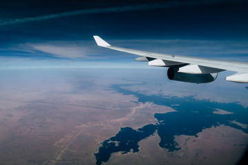Airplane flying over the Nil River in Africa