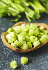 Fresh celery in wooden bowl