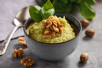 Mash potatoes with broccoli, cheese and walnuts.