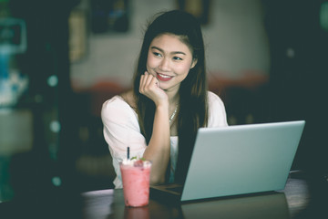 Beautiful Attractive Business Asian woman working with laptop and looking in monitor smile and have positive emotional feeling so happiness,Business Startup Concept
