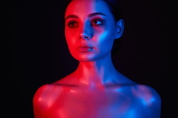 Beautiful Girl in red and blue bright lights