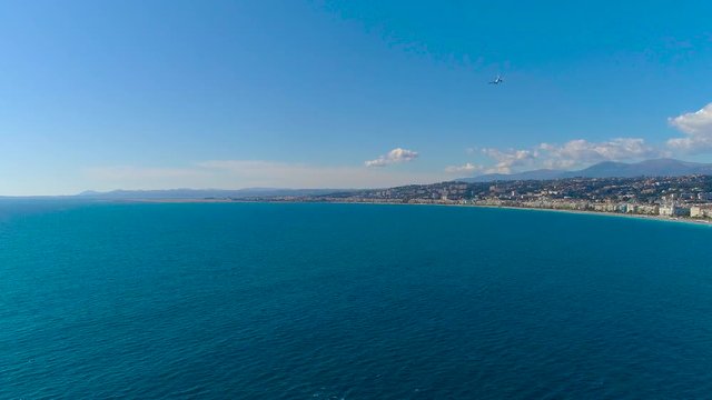 Aerial view of plane landing in Nice airport on Mediterranean sea 4K
