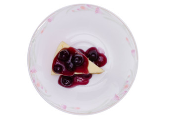 homemade blueberry new york cheesecake in plate isolated on white background - clipping paths