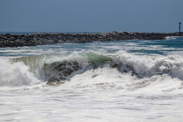 Large wave crashing at The Wedge in Newport Beach