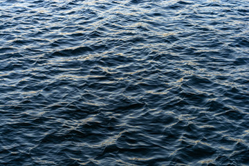 beautiful calm waves on the river at sunset