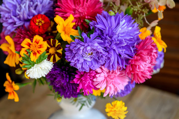 Autumn flowers, a bouquet of asters and marigolds. Selective focus