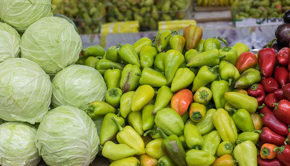 Assortment of fresh vegetables at market counter, vegetable shop