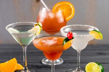 Different kinds of cocktails on the wooden background