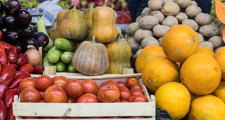 Obraz na płótnie Canvas Assortment of fresh vegetables at market counter, vegetable shop