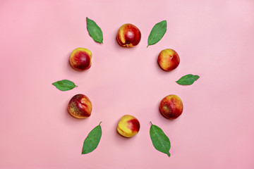 Abstract ornament -Fresh harvested nectarines lies on blue background. Vegetables vitamin Keratin Natural  Peach Organic Top View Flat Lay Rustic Style. Country Village Agriculture concepts Empty text
