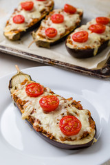 healthy bulgur stuffed eggplant with cherry tomatoes and cheese