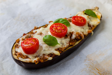 healthy bulgur stuffed eggplant with cherry tomatoes and cheese