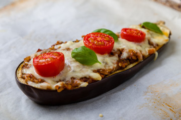 healthy bulgur stuffed eggplant with cherry tomatoes and cheese