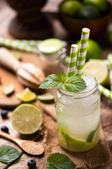 Caipirinha cocktail on wooden table