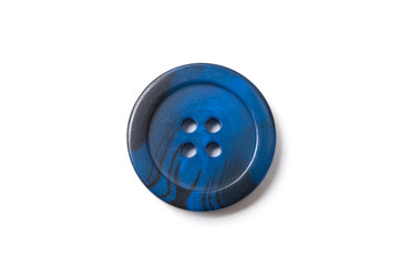 closeup of blue sewing buttons on white background