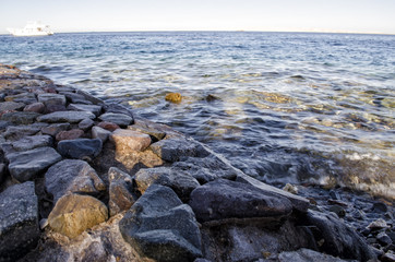 stony shore and sea