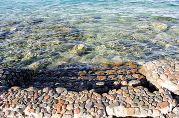 stony shore and sea