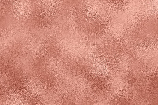 Abstract metallic background. Rose Gold foil texture.