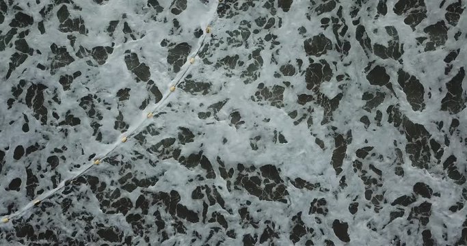 Drone aerial view sea waves. Blue water background  