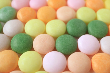 Fototapeta na wymiar Lined Up Beautiful Pastel Colored Round Shaped Candies, for Background and Banner 