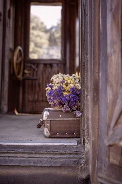 Suitcase and dried flowers 1