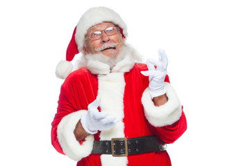 Christmas. Good Santa Claus in white gloves shows faces, grimaces, shows his tongue. Not standard behavior. Isolated on white background.