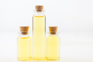 Obraz na płótnie Canvas essential oil in beautiful bottle on table