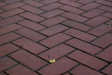 Cobble stone pavement surface pattern in red tone.