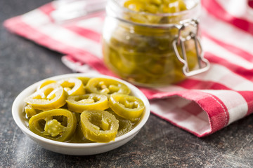 Slices of preserved Jalapeno pepper.