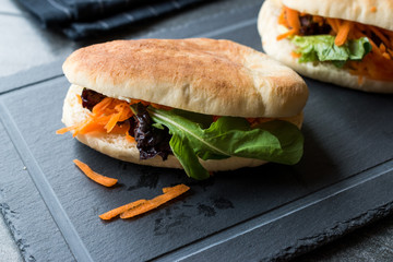 Vegan / Vegetarian Pita Bread Bun Sandwich Taiwan's Gua Bao with Carrot Slices and Greens from Asia
