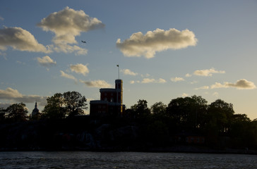 Boats and landmarks at Stockholm waterfront at sunset