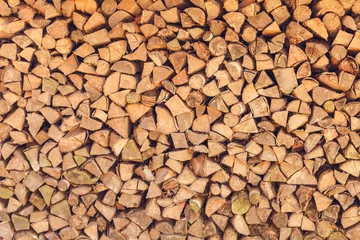 Wall murals Firewood texture background of firewood stack