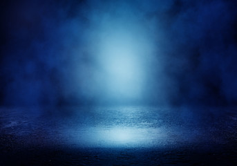 Background of an empty room with smoke and neon light. Dark blue abstract background