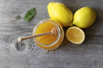 ripe lemons with home sweet honey useful