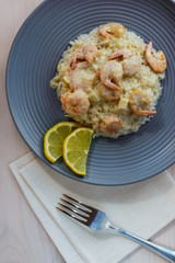 Shrimp in cream sauce with rice and lemon