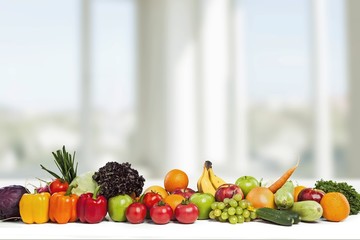 Colorful ripe vegetables and fruits on background