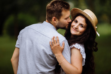 Obraz premium Romantic couple in the park at summer