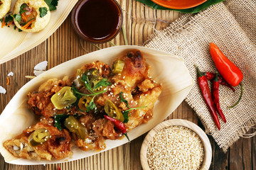 various street food with pani puri, chicken wings and coxinha on rustic background. balinese nasi campur and indian street food © beats_