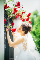 Beautiful bride in white dress in the garden 