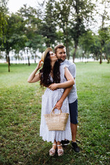 Pretty couple in the forest at summer 