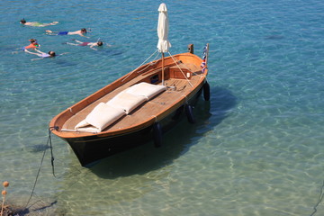 view of the coast with boats in Lindos bay, Greece