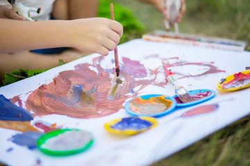 Children draw in summer park. Art concept