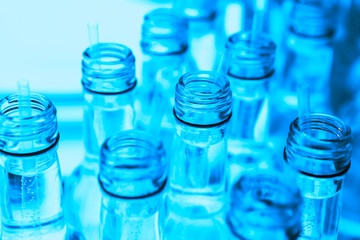 The necks of the bottles of mineral water are highlighted in blue