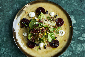 Salad with roasted beetroot beet, Goat Cheese, Candied Walnuts, Spring Greens, and Herbs. Healthy diet  and Vegetarian food
