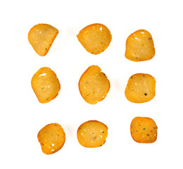 baked bread chips with dill and onions isolated on white