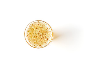 A glass of light beer isolated on a white background. View from above.