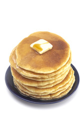 Stack of Freshly Made American Style Pancakes with Metling Butter