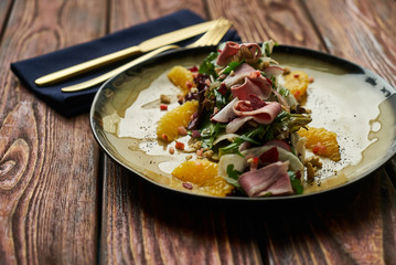 Vegetable salad with Smoked duck breast. Healthy fresh vegetable salad with smoked duck, Candied Walnuts, Spring Greens, Orange and Herbs