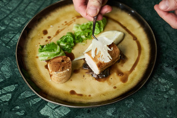 Chicken galantine, mushroom fricassee, young cabbage and sauce. chicken sausage with baked green cabbage. Healthy diet food concept.