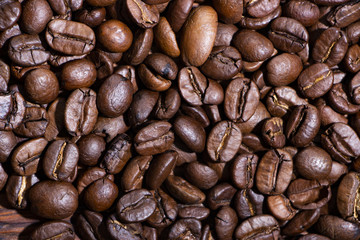 Coffee seeds, texture, top view, with hard side light and high contrast